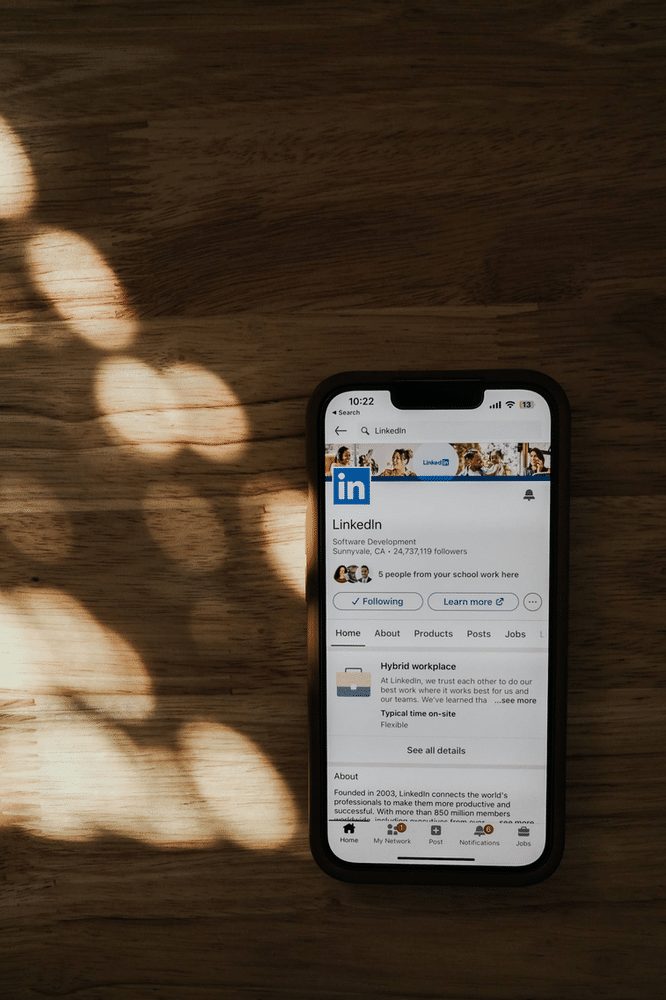 A cellphone with a screen showing LinkedIn