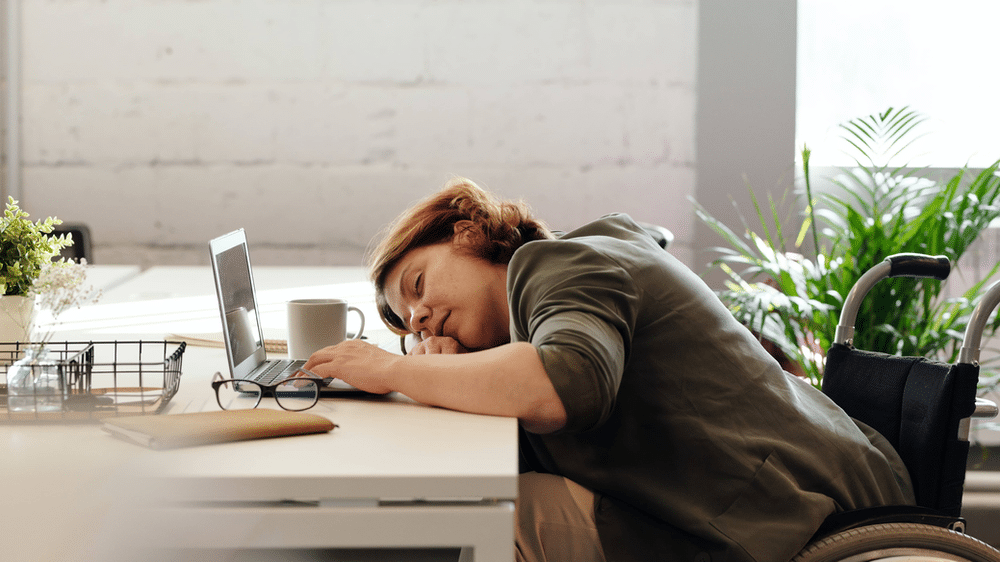 Woman sleeping at her laptop