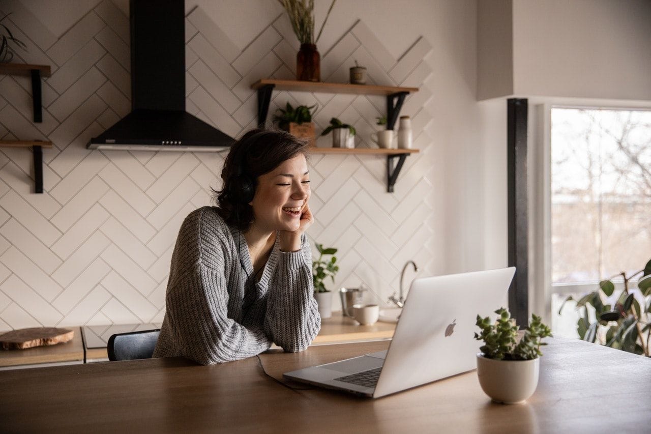Professional working on a laptop at home in a calm, modern workspace