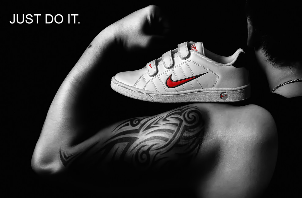 Nike “Just Do It” campaign showing a sneaker on a flexed arm, symbolizing powerful brand communication and motivation
